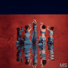 a group of women are dancing in the water with the letters ms visible