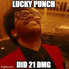 a man wearing sunglasses and a red suit says lucky punch did 21 dmg .