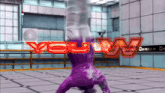a person in a purple suit is doing a handstand in front of a sign that says " you win "