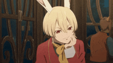 a girl with bunny ears and a red jacket is smiling
