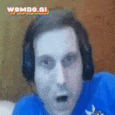 a man wearing headphones and a blue shirt with the word wombo.ai on the bottom right