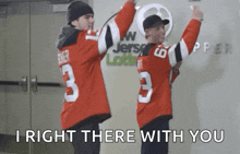 a man in a jersey with the number 3 on it is standing next to another man