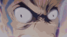 a close up of a person 's face with a very angry expression on it .