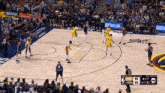 a basketball game is being played in front of a crowd and the score is 95 to 95
