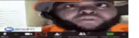 a man with a beard is looking at the camera while wearing a hard hat on a zoom call .