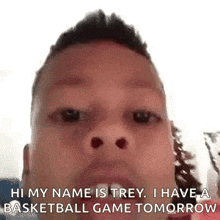 a man is looking at the camera and saying `` hi my name is trey , i have a basketball game tomorrow ''