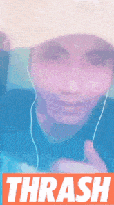 a person wearing headphones and a hat with the word thrash on the bottom