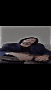 a blurry picture of a person 's face in a dark room .