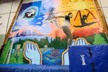 a man is doing a trick in front of a mural that has the word norberts on it