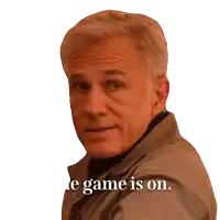 a man with the words " the game is on " on the bottom