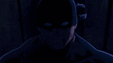 a man with a mask on his face is smiling