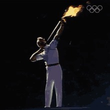 shooting arrow olympics lighting ceremony olympic flame archery