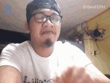 a man wearing glasses and a hat with the hashtag deafeph on the bottom right