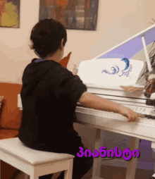a person playing a piano with a purple border that says ' georgia '