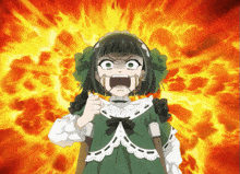 a little girl in a green dress is making a funny face