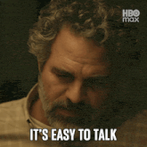 a man with a beard says " when it 's not your loss " on a screen