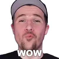 a man with a beard is blowing a kiss and the word wow is on the face