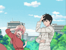 a boy and a girl are standing next to each other and the girl is pointing at the boy