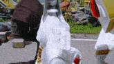 a statue of a robot with a red light on its face