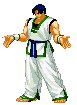 a pixel art of a man in a taekwondo uniform standing on a white background .