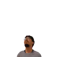 a man with a beard and glasses looks up at the number 13