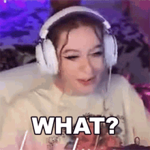 a girl wearing headphones is sitting in front of a computer and says what ?