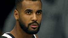 a man with a beard has a pink lip