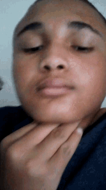 a close up of a man 's face with his eyes closed