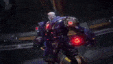 a close up of a robot with red lights on its arms .