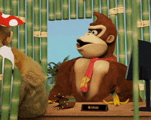 a donkey kong mascot sits at a desk with a name plate that says udge
