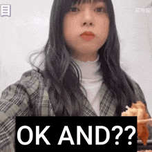a girl is eating a piece of food with the word ok and written on the bottom