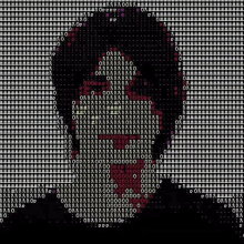 a computer screen with a picture of a person 's face made up of numbers and letters