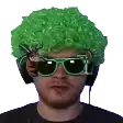 a man wearing a green wig and sunglasses is looking at the camera .