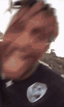 a blurry picture of a man 's face with a mask on it .