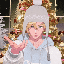 a man wearing a white hat stands in front of a christmas tree with korean writing on it