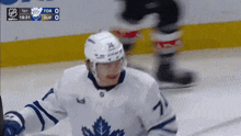 a hockey player in a white jersey with the number 7 on it