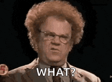 a man with curly hair is wearing glasses and a suit and tie and is asking what .