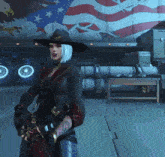 a woman in a cowboy hat stands in front of an american flag on a truck