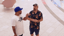 two men are standing next to each other and the word inter is on the tile floor