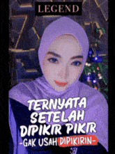 a woman wearing a purple hijab with legend written on the bottom