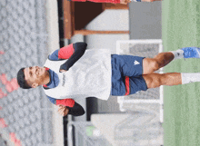 a soccer player wearing a vest that says macron