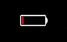 a white battery with a red stripe on the bottom is empty .