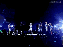 a group of people on a stage with anahioverdose in the corner