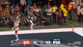 a football game is being played between kc and phil