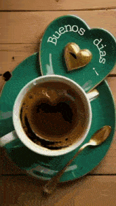 a cup of coffee on a saucer with a heart shaped foam and a heart shaped chocolate on a heart shaped plate .