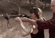 Norman Reedus Practicing With Crossbow For The Walking Dead GIF