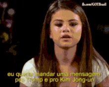 a woman with long hair says eu que tu mandar uma mensagem pro trump and pro kim jong-un