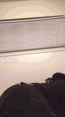 a tiktok video of a person laying on their back