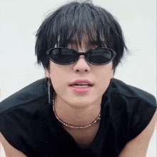 a close up of a person wearing sunglasses