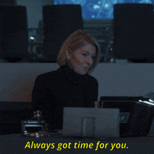 a woman sitting at a desk with the words " always got time for you "